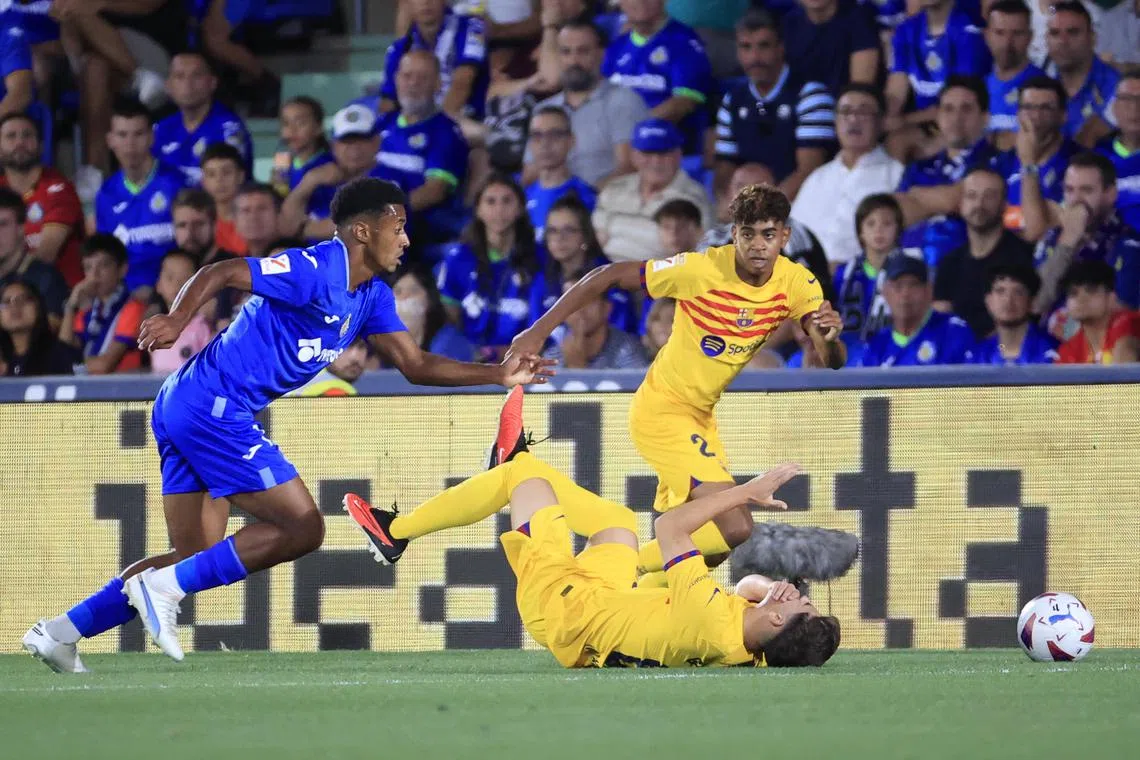 Barcelona forward Lamiena Yamal (right) in action against Getafe's Carle Alena during the their La Liga match at the Coliseum Alfonso Perez in Getafe.