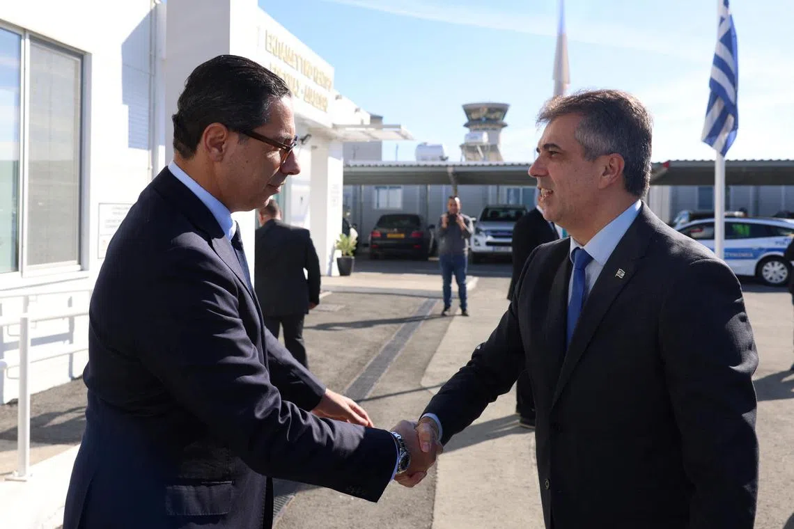 Cyprus Foreign Minister Constantinos Kombos (left) welcomes his Israeli counterpart Eli Cohen in Larnaca.