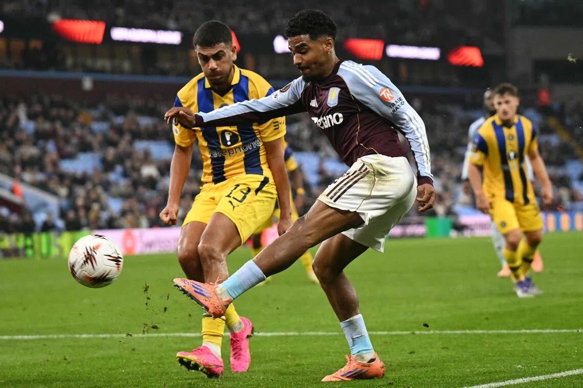 Aston Villa's Ian Maatsen scores his team's first goal against Maccabi Tel Aviv.
