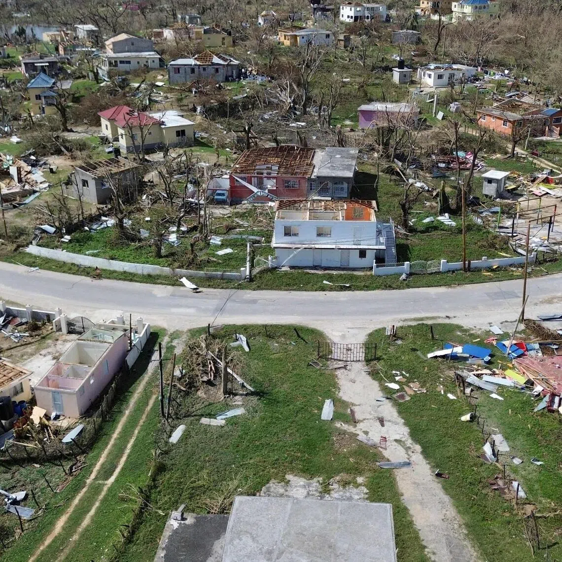 An aerial view shows damaged buildings in the aftermath of Hurricane Melissa in Lewis Town, St Elizabeth, Jamaica, on Oct 31, 2025. 
