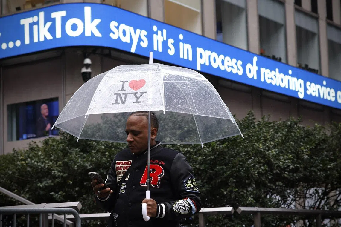 A display shows information about TikTok outside the Fox News building in New York City on Jan 19.