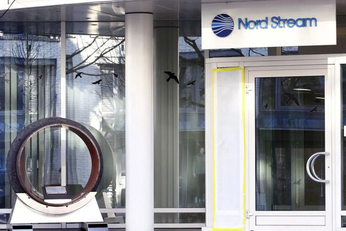 The logo of Nord Stream AG and a segment of a pipeline tube are seen at the headquarters of Nord Stream AG in Zug, Switzerland March 1, 2022. REUTERS/Arnd Wiegmann/File Photo