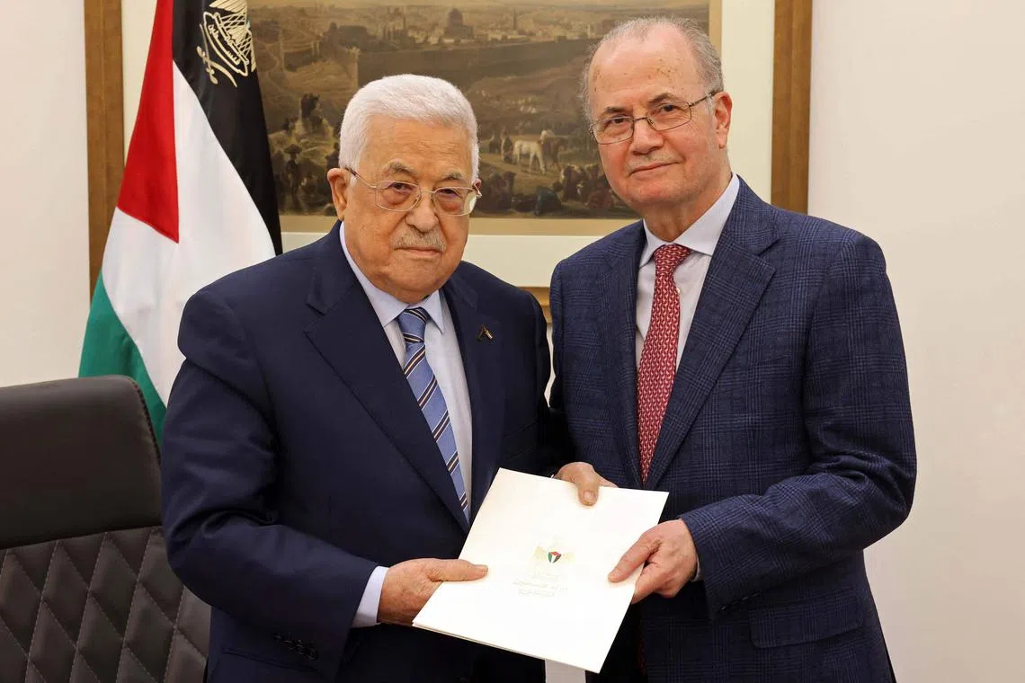 This handout picture provided by the Palestinian Authority's Press Office (PPO) shows Palestinian President Mahmud Abbas (left) posing with the newly appointed Palestinian Prime Minister Mohammad Mustafa, in Ramallah on March 14. Mr Mustafa is a long-trusted adviser on economic affairs. 