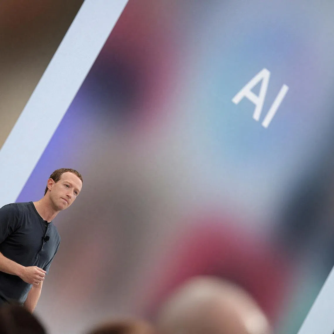 FILE PHOTO: Meta CEO Mark Zuckerberg delivers a speech, as the letters AI for artificial intelligence appear on screen, at the Meta Connect event at the company's headquarters in Menlo Park, California, U.S., September 27, 2023. REUTERS/Carlos Barria/File Photo