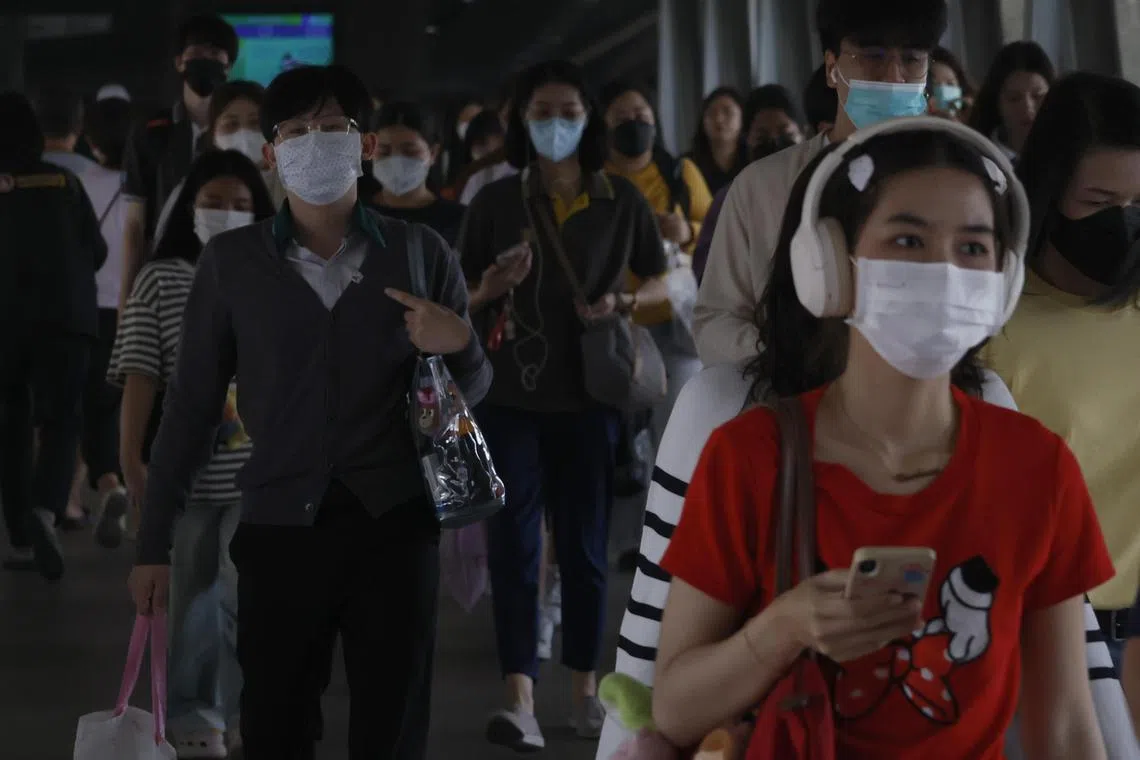 People wearing protective masks amid heavy air pollution in Bangkok, Thailand, on Jan 23.