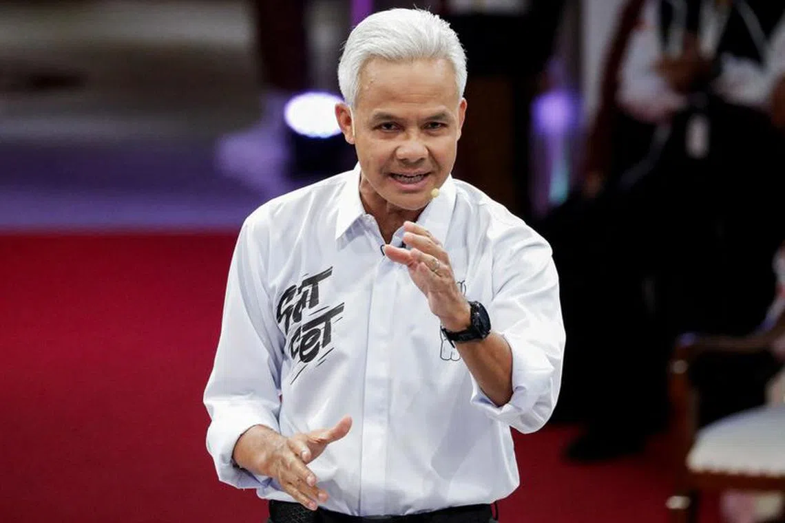 FILE PHOTO: Ganjar Pranowo, presidential candidate of the ruling Indonesian Democratic Party of Struggle (PDI-P), speaks during a televised debate at the election commission headquarters in Jakarta, Indonesia, December 12, 2023. REUTERS/Ajeng Dinar Ulfiana/File Photo