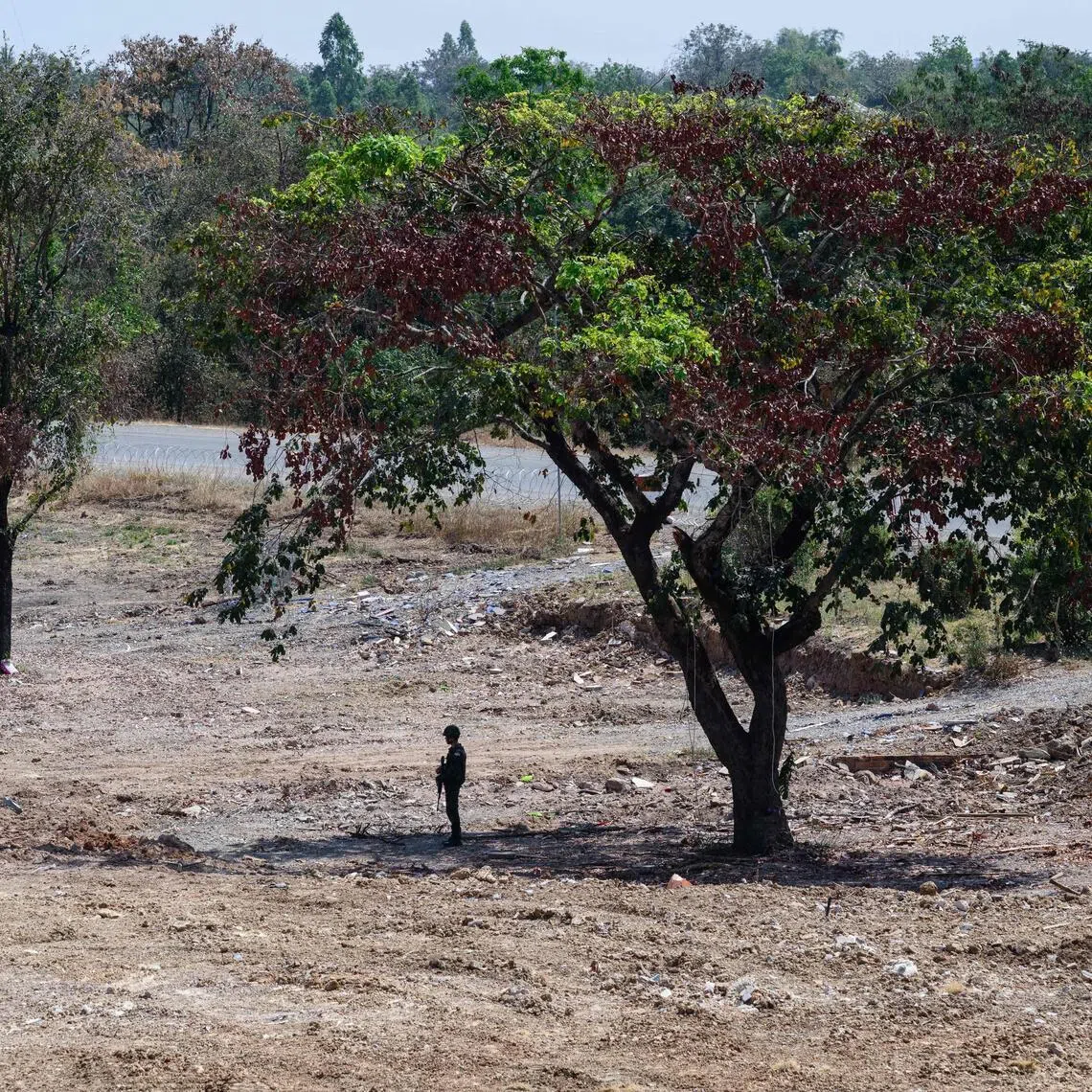 A Thai soldier stands guard during a military organised tour near Klong Paeng, in an area now controlled by the Thai forces following the border conflict with Cambodia on Feb 5.