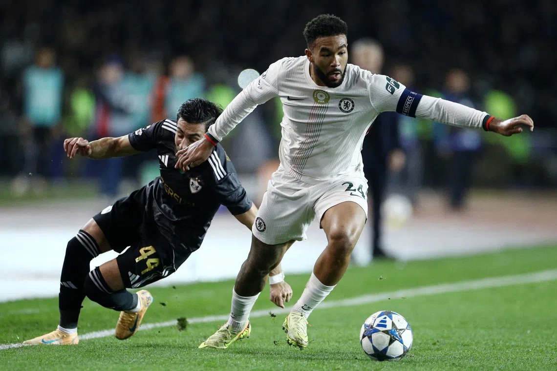 Soccer Football - UEFA Champions League - Qarabag v Chelsea - Tofiq Bahramov Stadium, Baku, Azerbaijan - November 5, 2025 Chelsea's Reece James in action with Qarabag's Elvin Cafarguliyev. REUTERS/Aziz Karimov