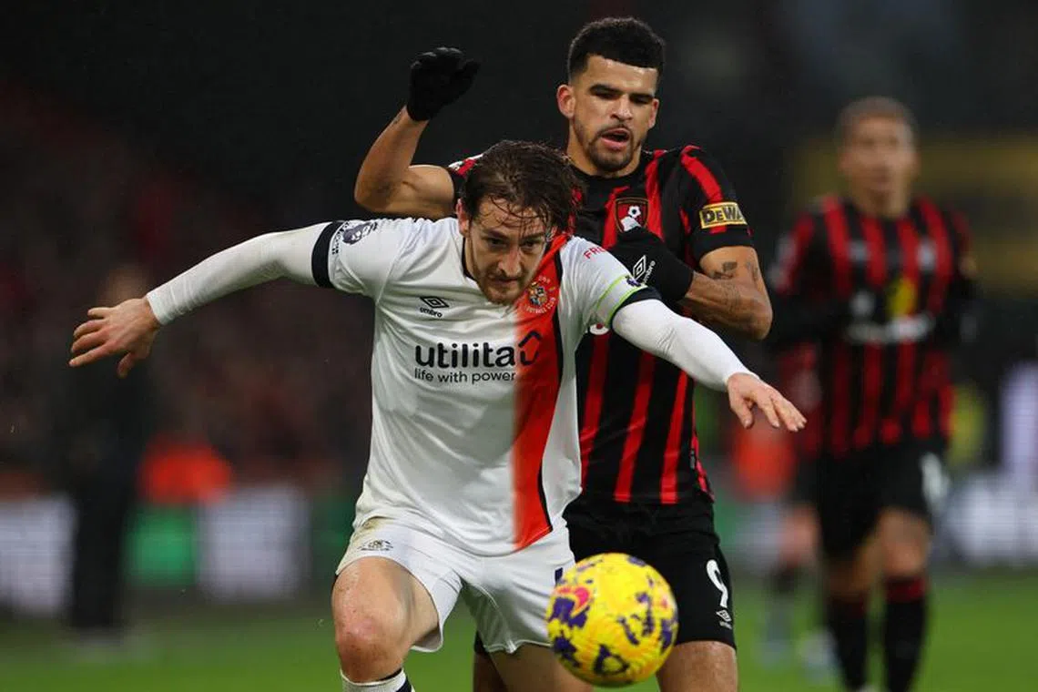 Soccer Football - Premier League - AFC Bournemouth v Luton Town - Vitality Stadium, Bournemouth, Britain - December 16, 2023 Luton Town's Tom Lockyer in action with AFC Bournemouth's Dominic Solanke REUTERS/Toby Melville/File photo