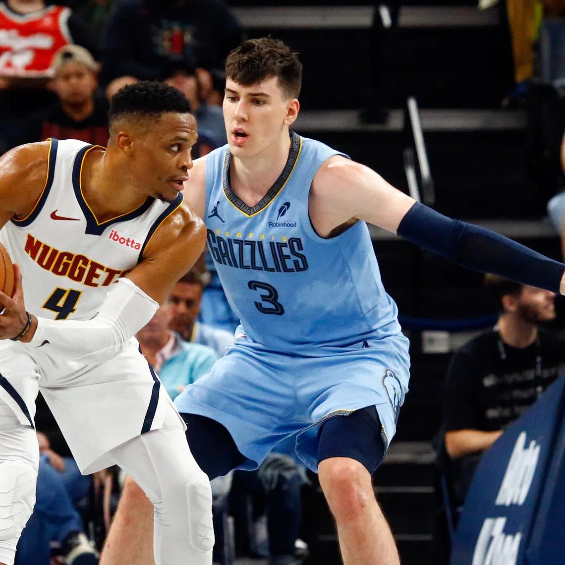 Nov 19, 2024; Memphis, Tennessee, USA; Denver Nuggets guard Russell Westbrook (4) handles the ball as Memphis Grizzlies forward Jake LaRavia (3) defends during the second half at FedExForum. Mandatory Credit: Petre Thomas-Imagn Images/ File Photo