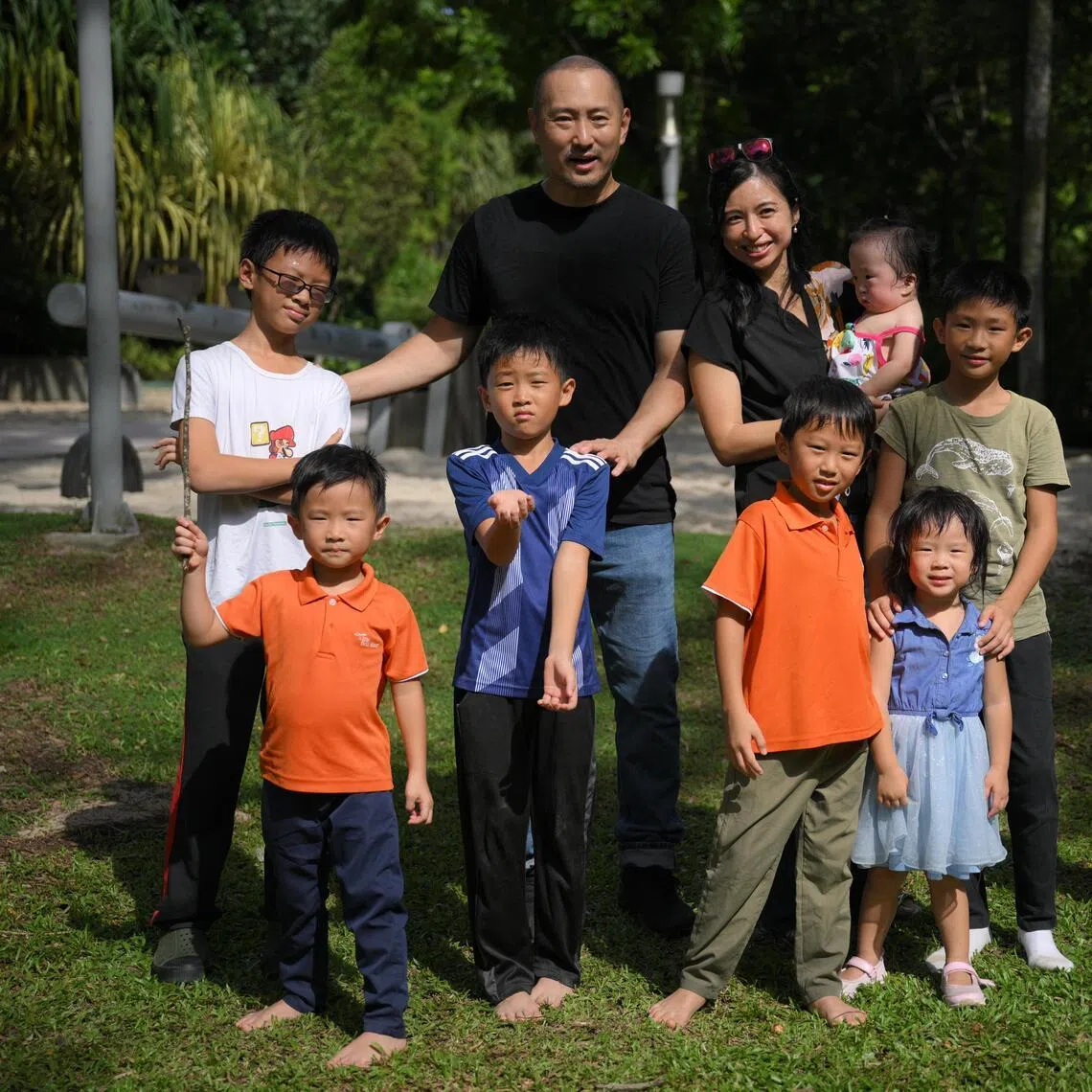 Video producer Eu-jin Lim and his wife Eunice Wong with their children, (from left) Ethan, 12; Eusebius, four; Ezekiel, seven; Emmanuel, six; Eva, 15 months; Esther, two; Evron, nine; and Elijah, 10.