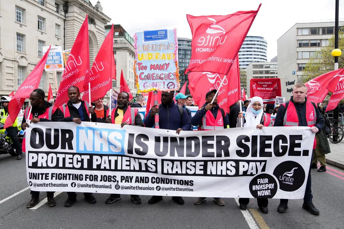 Nurses march towards Trafalgar Square amid an ongoing dispute with the government over pay, in London, Britain, on May 1, 2023.