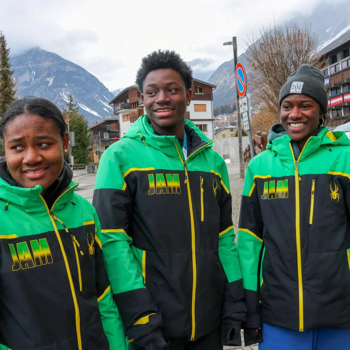 18-year-old alpine skier representing Jamaica, Henri IV Rivers, stands by his sisters, Helaina and Henniyah, ahead of the alpine skiing race at the Milano Cortina 2026 Winter Olympics, in Bormio, Italy, February 10, 2026. REUTERS/Denis Balibouse