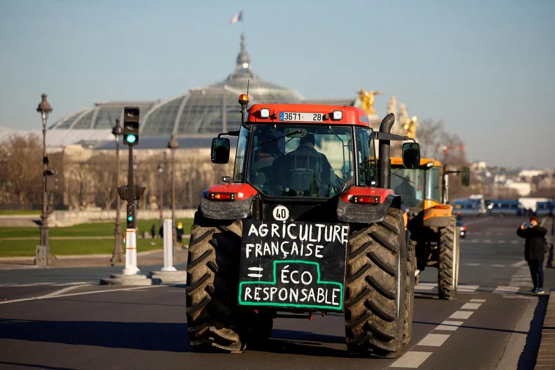 French farmers protest in Paris over pesticide restrictions and other environmental regulations they say are threatening agricultural production.