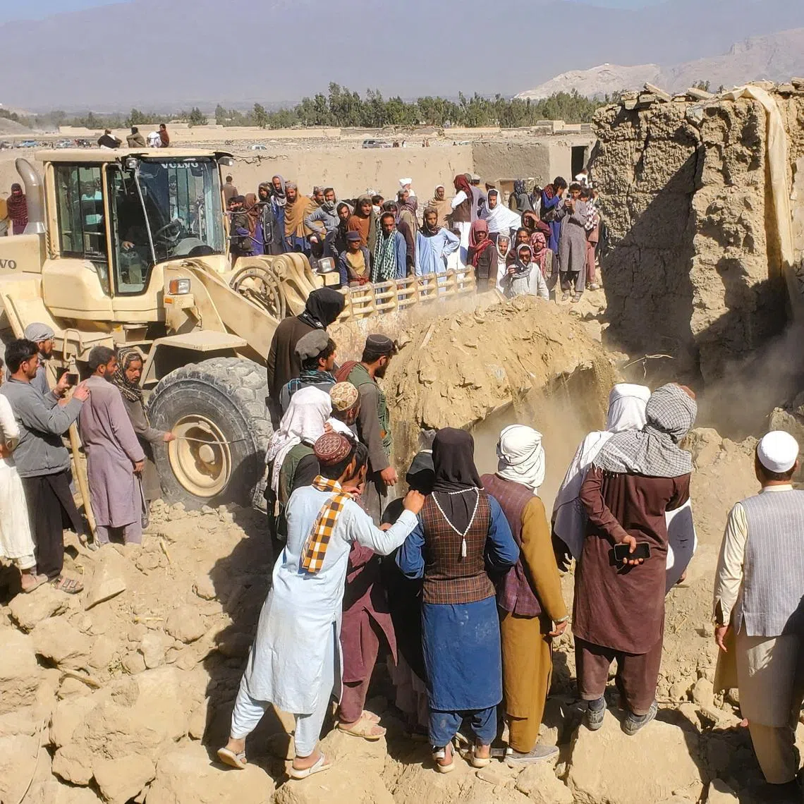 Residents gather at the site, following the Pakistani airstrikes, in Bihsud district, Nangarhar province, Afghanistan, February 22, 2026. REUTERS/Stringer