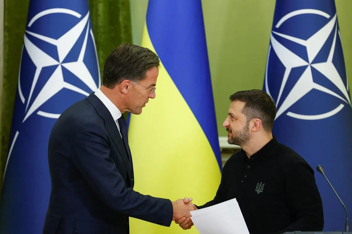 Ukraine's President Volodymyr Zelenskiy and NATO Secretary General Mark Rutte shake hands after a press conference, amid Russia's attack on Ukraine, in Kyiv, Ukraine October 3, 2024. REUTERS/Valentyn Ogirenko
