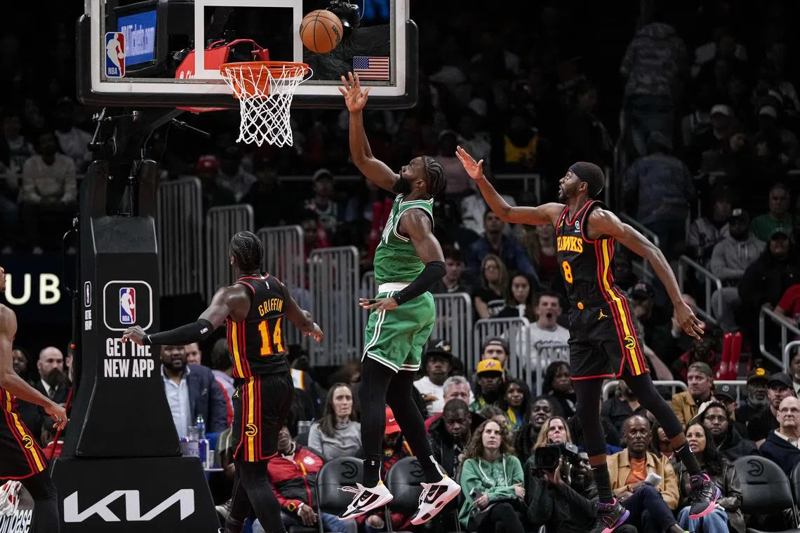 Boston Celtics guard Jaylen Brown scoring against the Atlanta Hawks during the second half of their NBA game at State Farm Arena on Nov 16, 2022. 