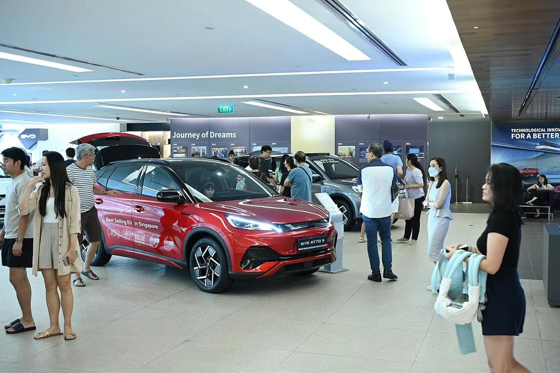 Customers looking at cars in BYD car Showroom along Alexandra Road on 6 January. 2024. 
Crowds are expected at car showrooms following the big drop in certificate of entitlement premiums on Wednesday and lowered car prices ahead of the Singapore Motorshow.