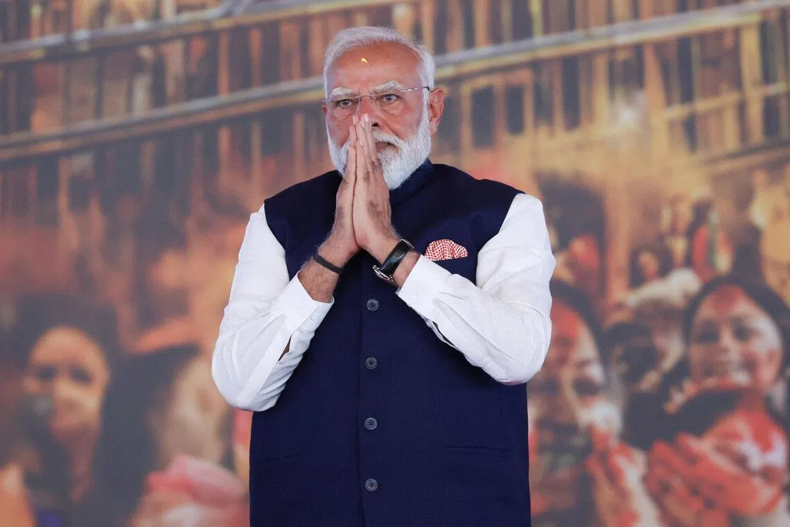 India's Prime Minister Narendra Modi gesturing as he attends a swearing-in ceremony of Suvendu Adhikari as the Chief Minister of West Bengal, in Kolkata on May 9, 2026. 