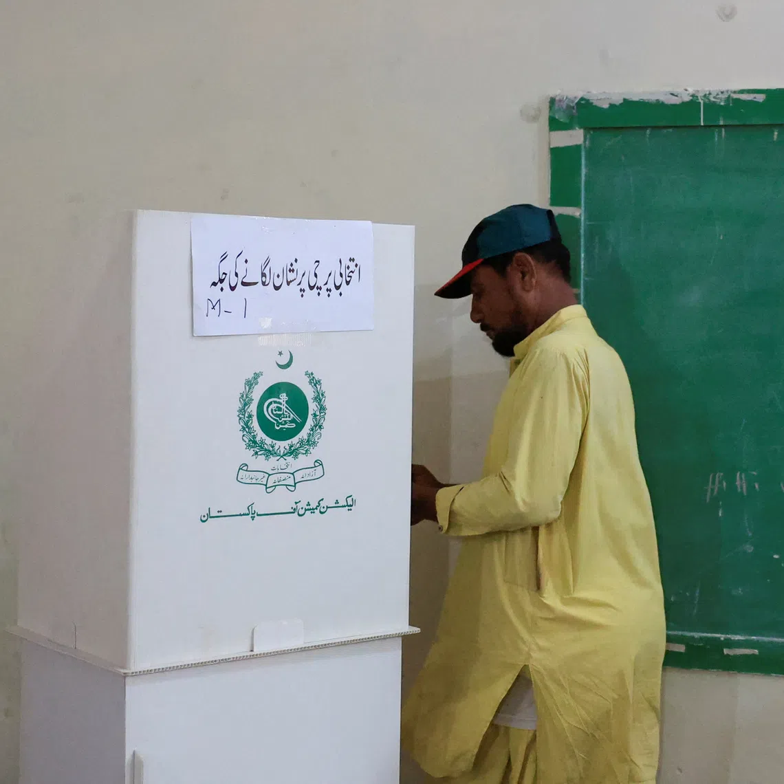 A man votes during the second phase of the Azad Jammu and Kashmir (AJK) Legislative Assembly elections at a polling station in Karachi, Pakistan, August 2, 2026. REUTERS/Akhtar Soomro