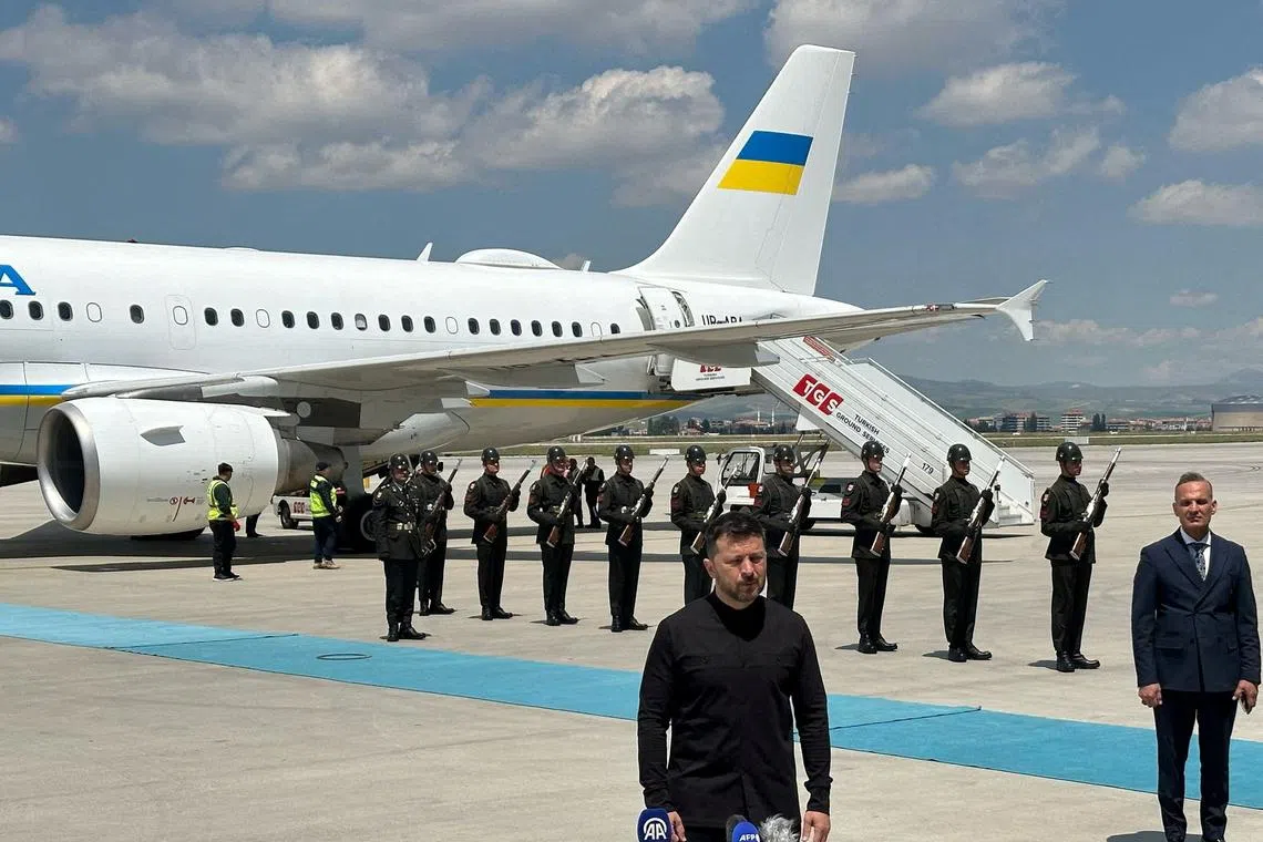Ukrainian President Volodymyr Zelenskiy talks to members of media upon his arrival at Esenboga Airport in Ankara, Turkey, May 15, 2025. REUTERS/Huseyin Hayatsever