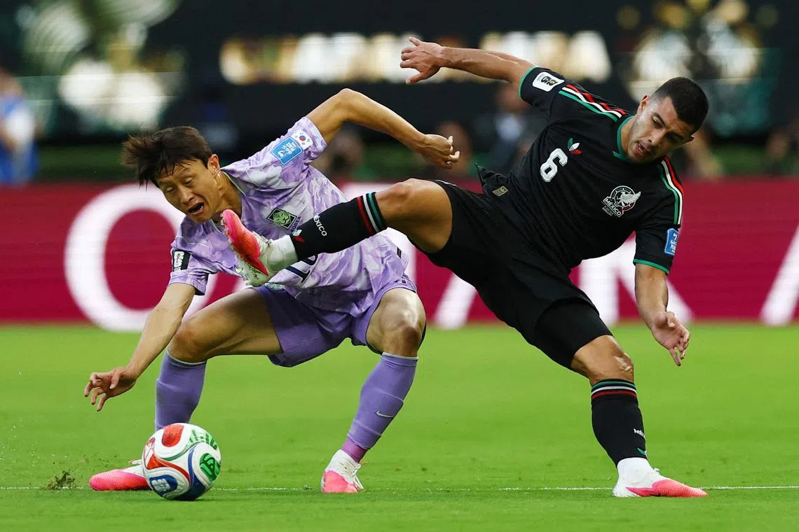 Soccer Football - FIFA World Cup 2026 - Group A - Mexico v South Korea - Estadio Guadalajara, Guadalajara, Mexico - June 18, 2026 South Korea's Lee Jae-sung in action with Mexico's Erik Lira REUTERS/Daniel Becerril