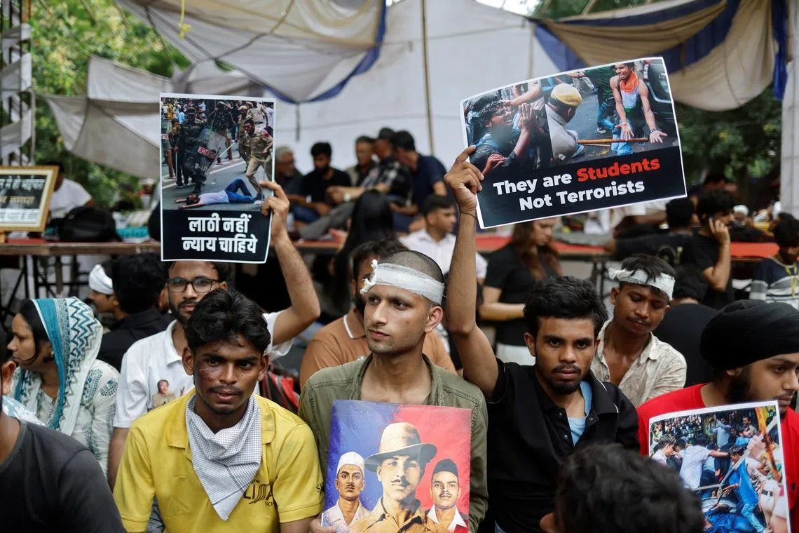 Under soaring pressure, India's education minister promises reforms and debate