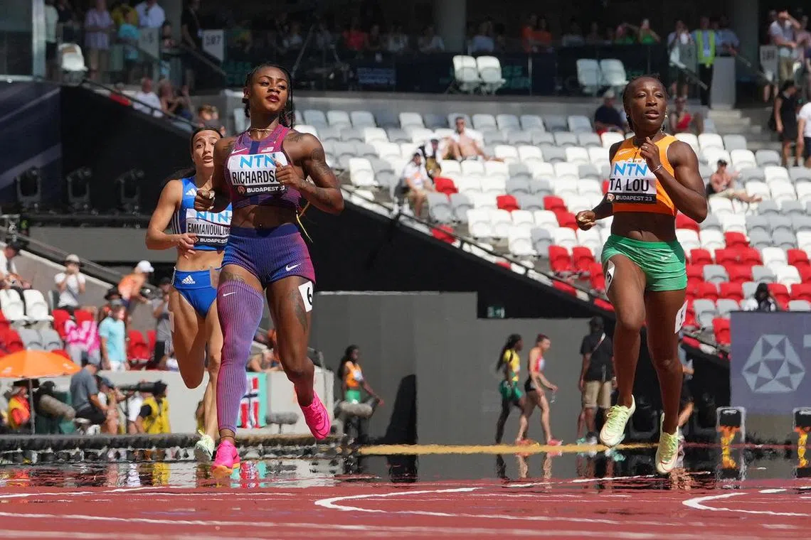 American Sha'carri Richardson easily winning her 200m heat in the fastest time of 22.16sec ahead of Cote D'Ivoire's Marie-Josee Ta Lou at the World Athletics Championships in Budapest on Aug 23, 2023.