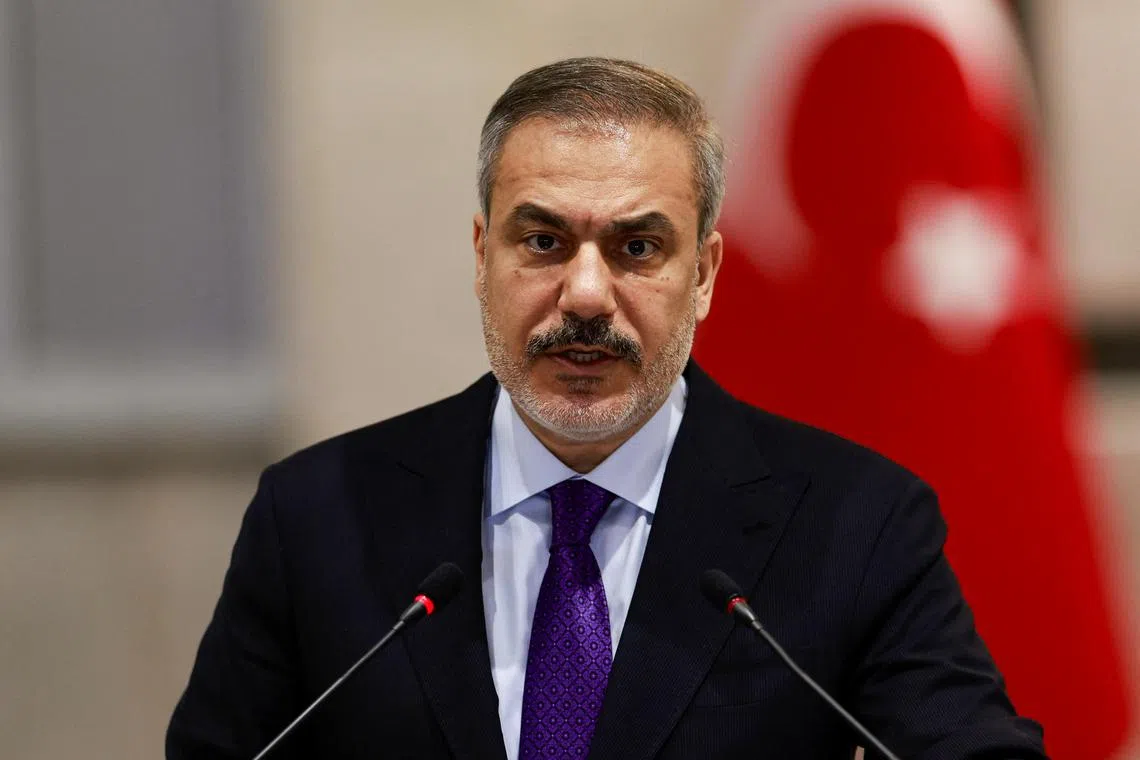 FILE PHOTO: Turkish Foreign Minister Hakan Fidan attends a press conference with Iraqi Foreign Minister Fuad Hussein (not pictured), in Baghdad, Iraq January 26, 2025. REUTERS/Thaier Al-Sudani/File Photo