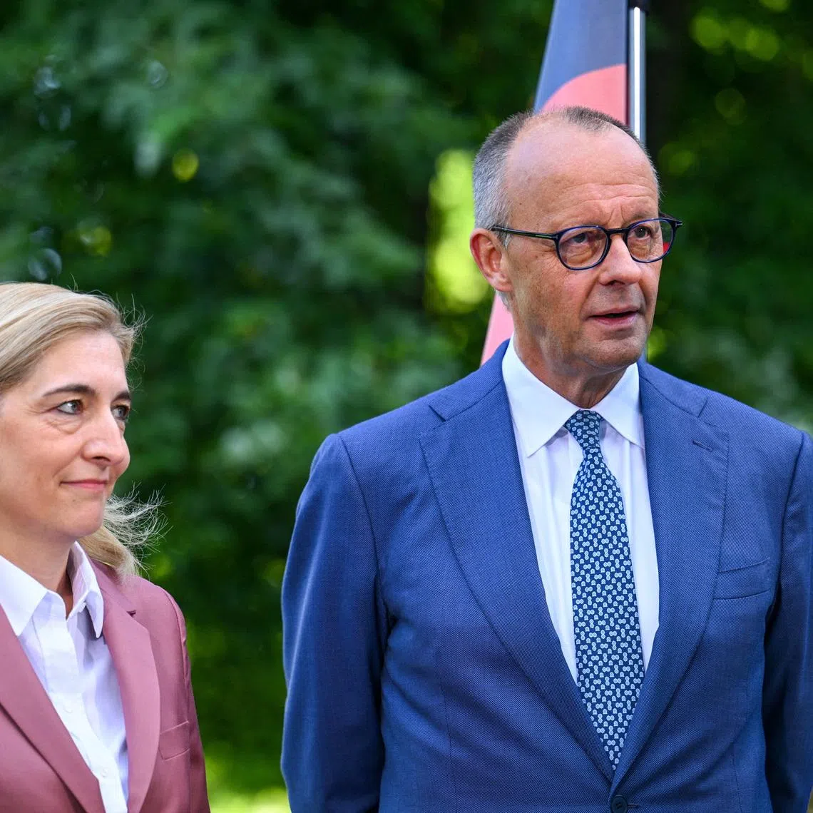 FILE PHOTO: German Chancellor Friedrich Merz and German Health Minister Nina Warken look on during a press statement announcing a cabinet reshuffle, after Jens Spahn resigned as the CDU/CSU parliamentary group leader, in Berlin, Germany, July 24, 2026. REUTERS/Annegret Hilse/ File Photo