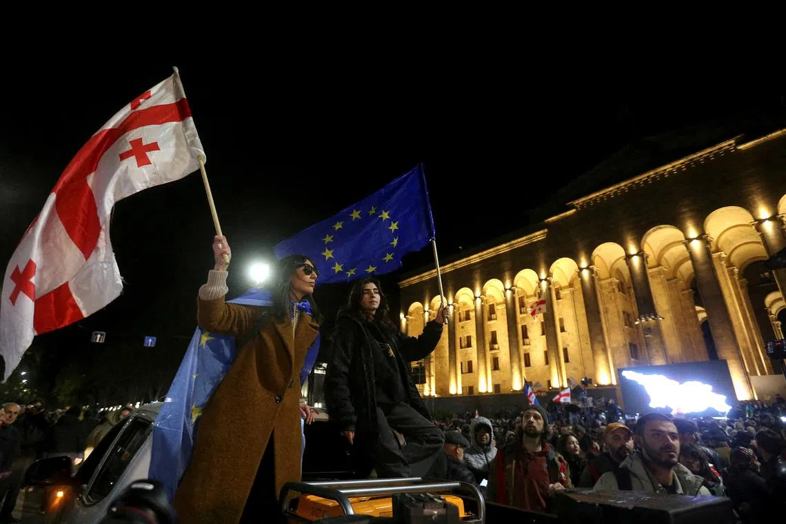 FILE PHOTO: Supporters of Georgia's opposition parties hold a rally to protest against the result of a recent parliamentary election won by the ruling Georgian Dream party, in Tbilisi, Georgia November 4, 2024. REUTERS/Irakli Gedenidze/File Photo