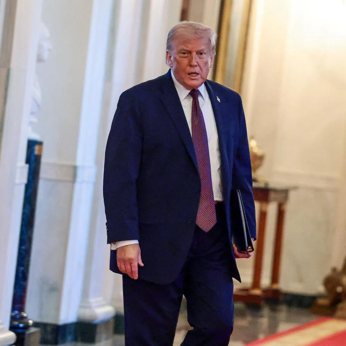 U.S. President Donald Trump arrives to honor the NHL Stanley Cup champions Florida Panthers at the White House in Washington, D.C., U.S., January 15, 2026. REUTERS/Evelyn Hockstein