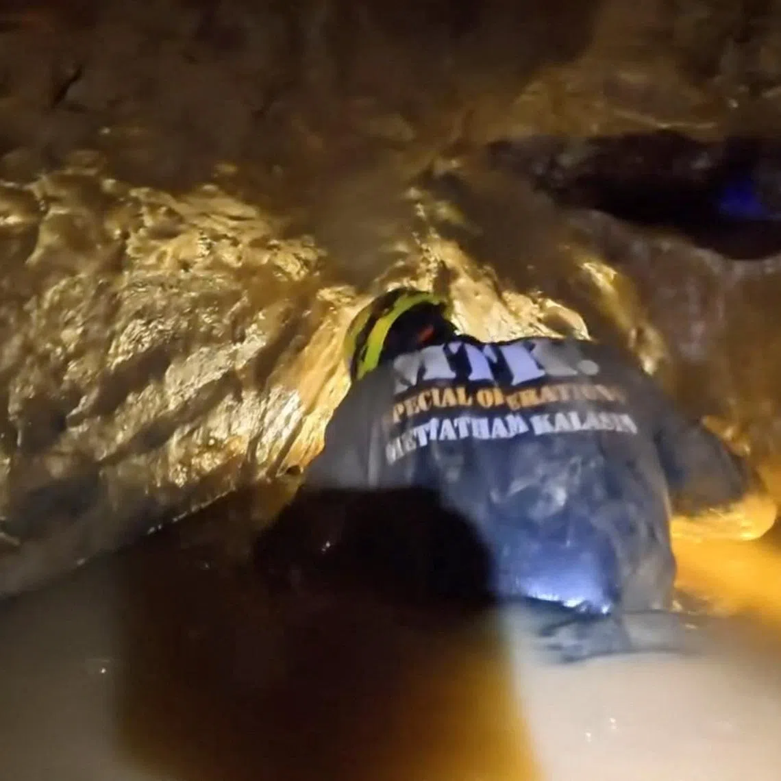 A member of a rescue team works to save people trapped in a cave, in Xaisomboun Province, Laos, May 25, 2026, in this screengrab taken from a handout video. Metta Tham Kalasin Rescue/Handout via REUTERS