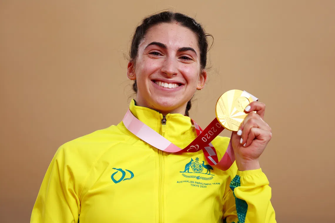 Tokyo 2020 Paralympic Games - Cycling Track - Women's C1-3 3000m Individual Pursuit - Medal Ceremony - Izu Velodrome, Shizuoka, Japan - August 25, 2021. Gold Medallist Paige Greco of Australia celebrates REUTERS/Thomas Peter