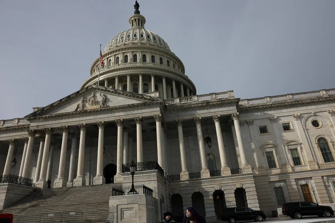 People walk past the U.S. Capitol building as the deadline to avoid partial government shutdown looms in Washington, U.S., January 18, 2024. REUTERS/Leah Millis/File Photo