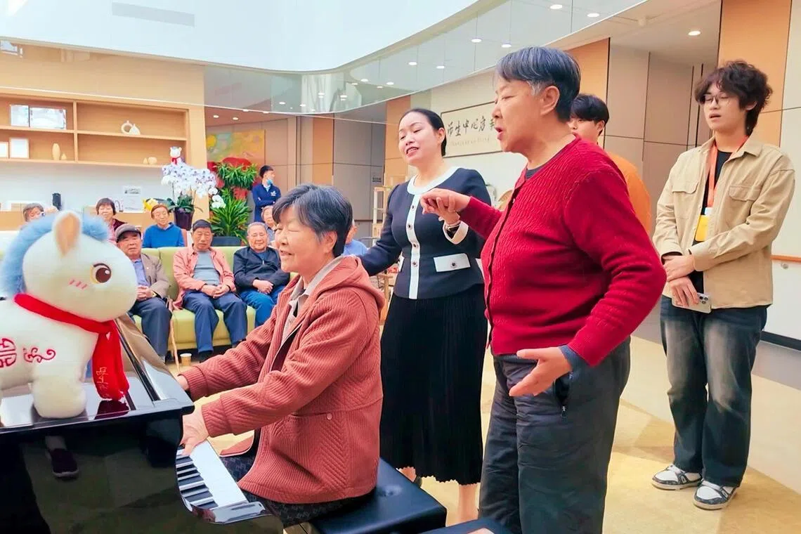 Residents and staff at Sindora Living’s senior living facility in Jinan. The 530-bed facility offers a range of activities, including literary salons and excursions.