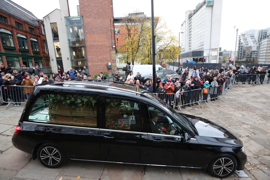 Crowds clapped warmly and held banners as the funeral cortege drove past United’s Old Trafford ground.