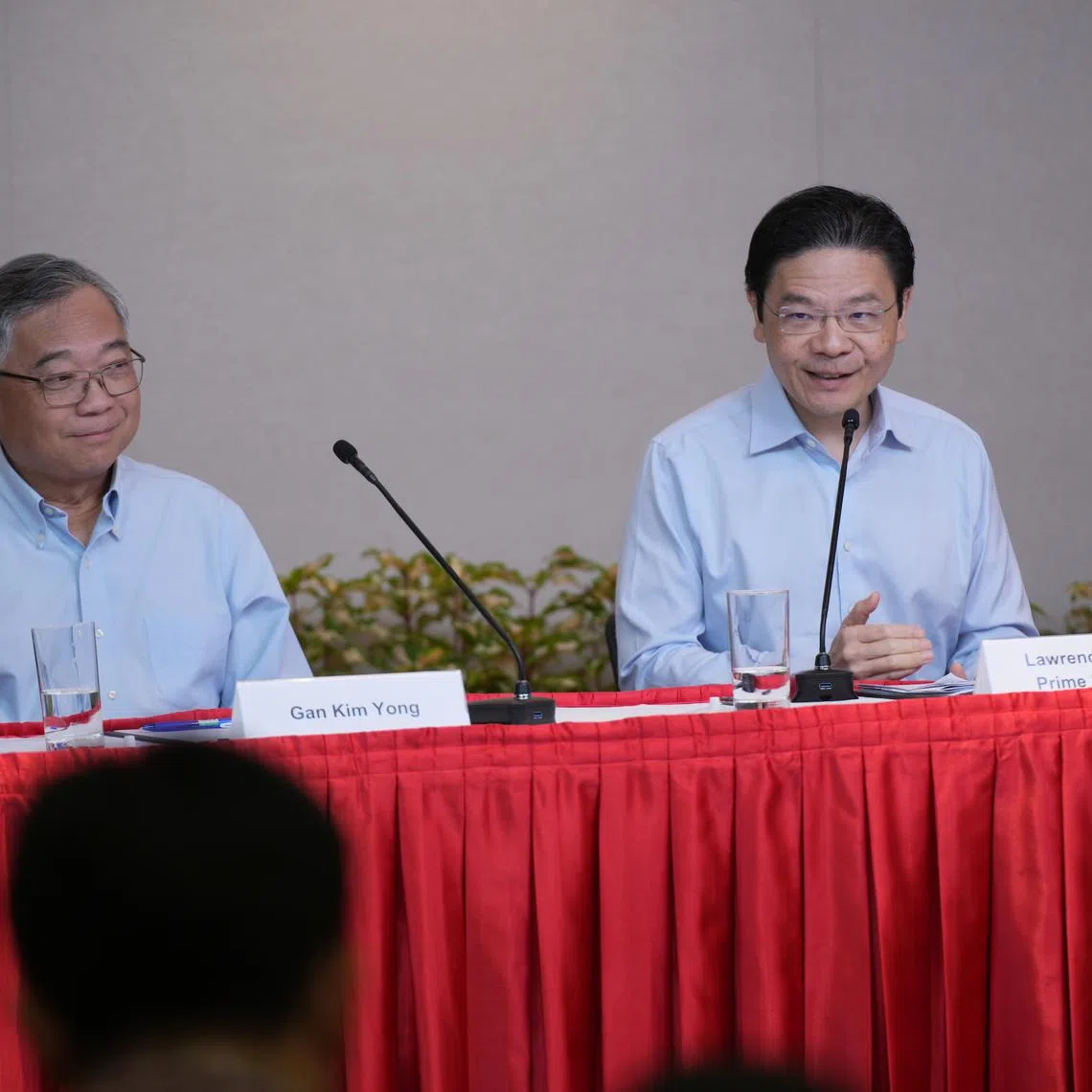 PM Lawrence Wong (right) and DPM Gan Kim Yong at a press conference on May 21.