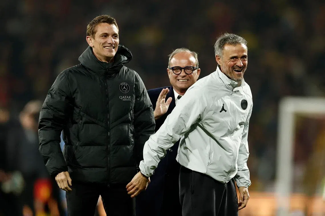 Soccer Football - Ligue 1 - RC Lens v Paris St Germain - Stade Bollaert-Delelis, Lens, France - May 13, 2026  Paris St Germain coach Luis Enrique celebrates with football advisor Luis Campos after winning Ligue 1 REUTERS/Benoit Tessier