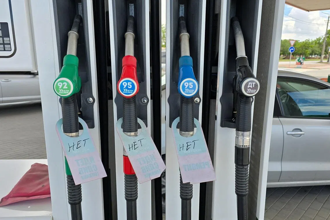 Signs reading \"No\" placed on fuel pump nozzles at a gas station after local authorities restricted petrol sales and introduced rationing amid a supply shortage that they said was caused by Ukrainian attacks on logistics routes, in the course of the Russia-Ukraine military conflict in the Black Sea resort city of Yevpatoriya, Crimea, June 11, 2026. Picture taken with a mobile phone. REUTERS/Alexey Pavlishak