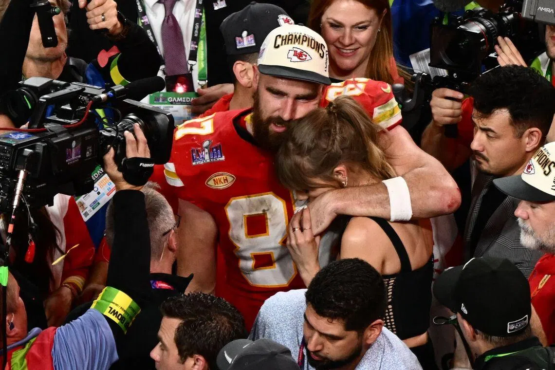 Taylor Swift and Travis Kelce embracing after the Chiefs won Super Bowl in 2024.
