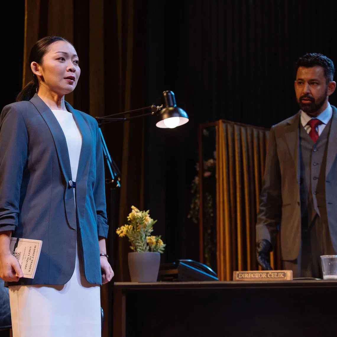 Coco Wang Ling (left) and Ghafir Akbar as an assistant and her boss in A Mirror.