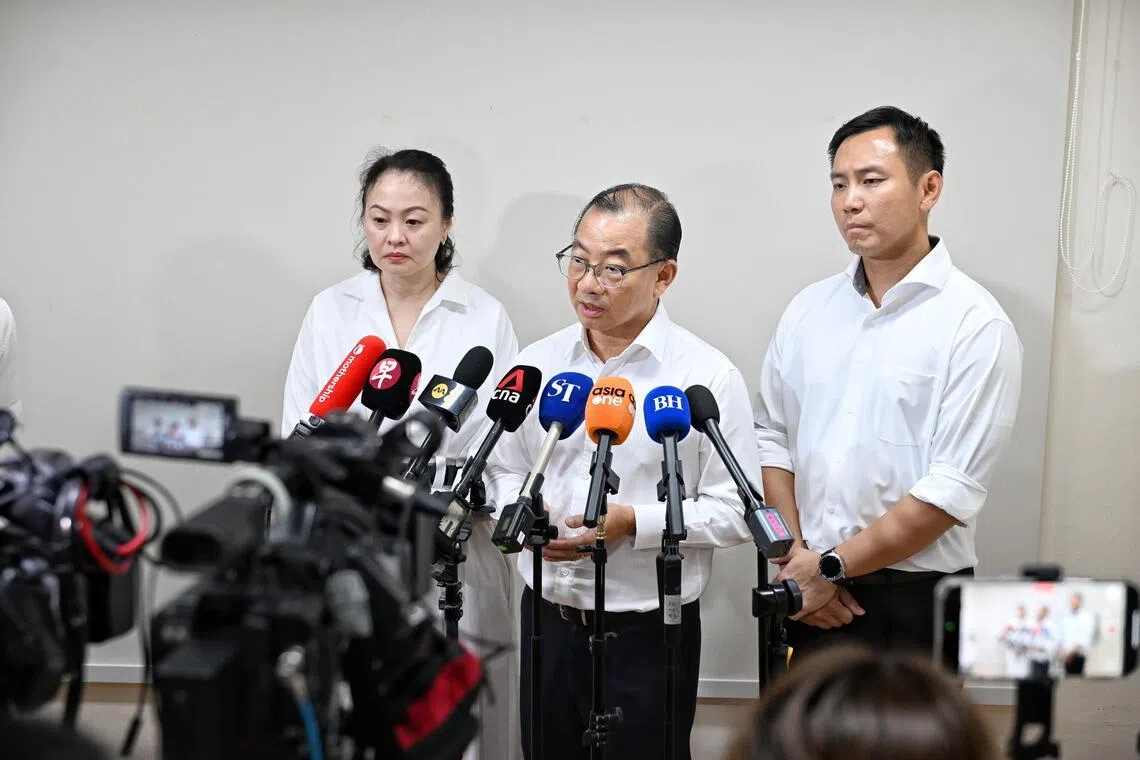Speaker of Parliament Seah Kian Peng (centre), flanked by fellow Marine Parade-Braddell Heights GRC MPs Diana Pang and Goh Pei Ming, speaking to the media on July 20.