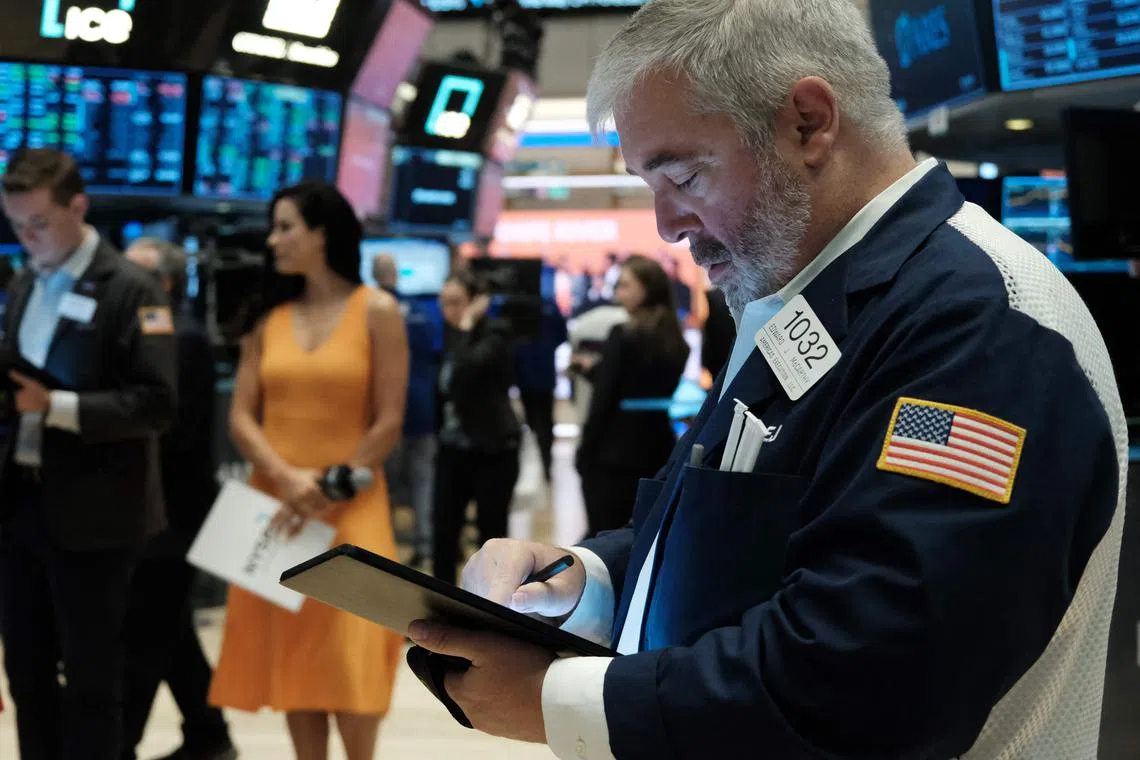 Traders work on the floor of the New York Stock Exchange, in New York City.