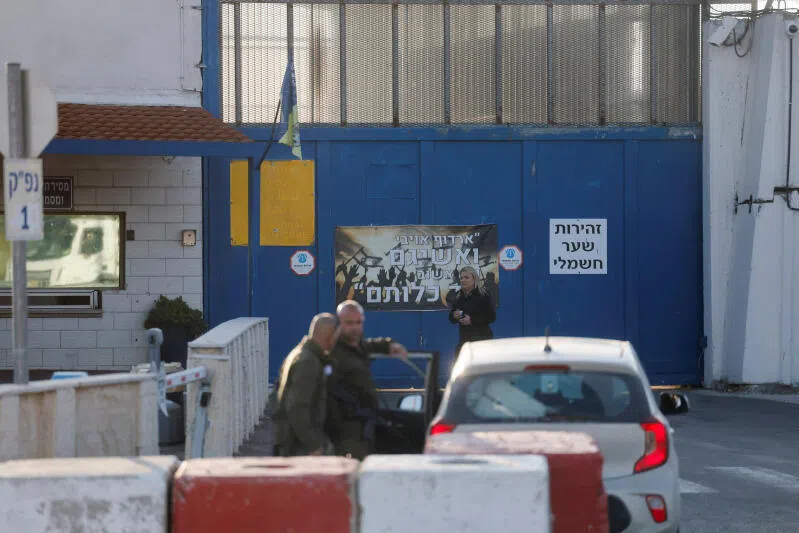 Security officials stand outside the Israeli military prison, Ofer, near Ramallah, in the Israeli-occupied West Bank.