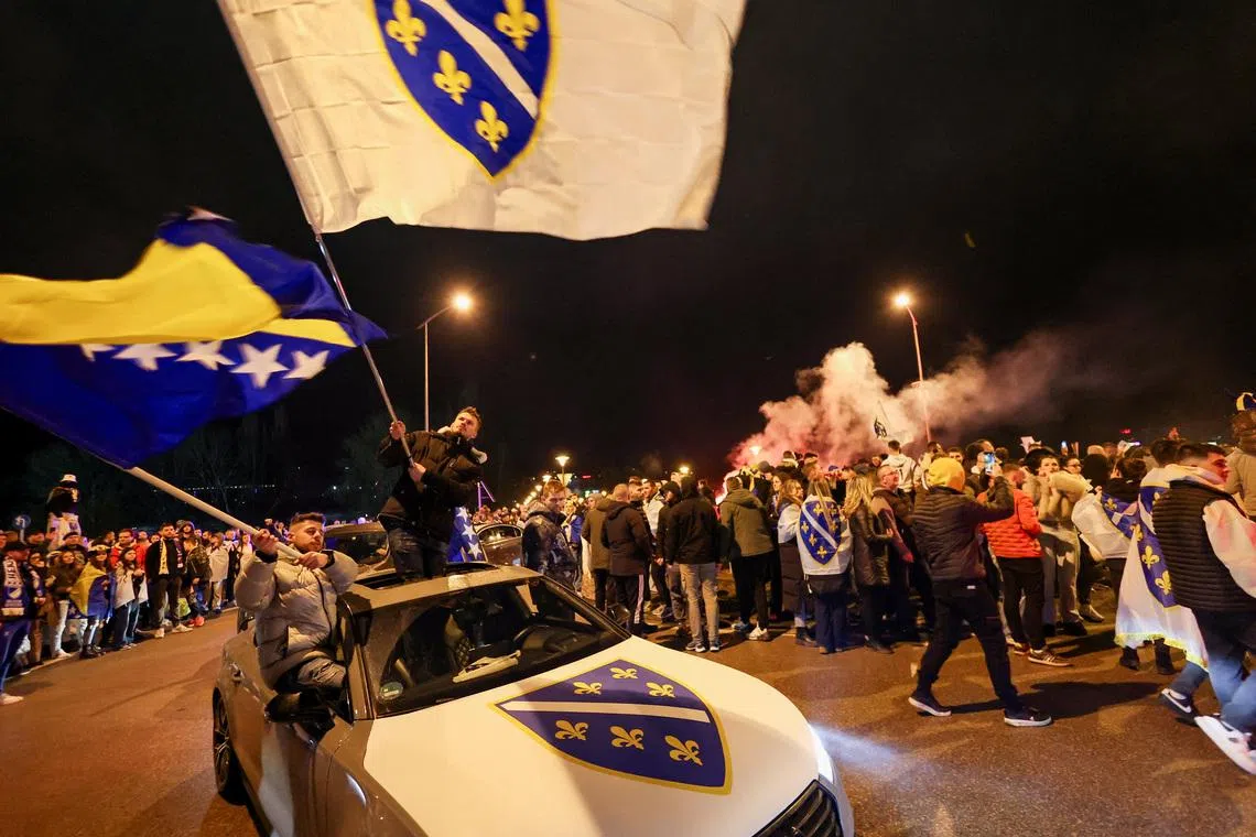 Bosnian supporters celebrate after Bosnia and Herzegovina beat Italy on penalties in a FIFA World Cup 2026 European playoff final, in Zenica, Bosnia and Herzegovina, April 1, 2026. REUTERS/Amel Emric