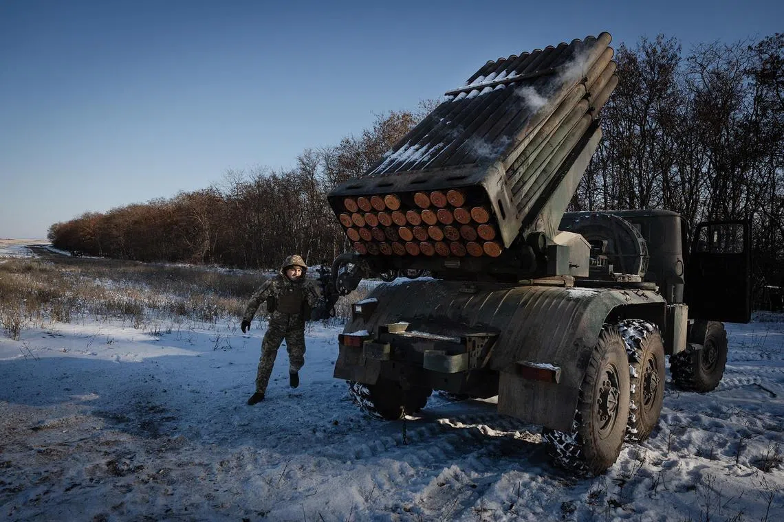 Members of Ukraine's 38th Separate Marine Brigade firing towards Russian positions along the Pokrovsk front line, in the Donbas region of eastern Ukraine, on Feb 17.