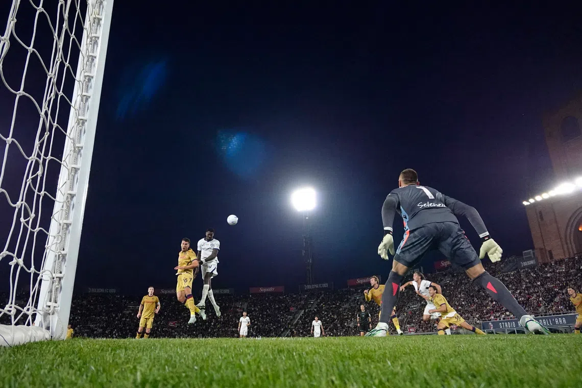 Soccer Football - Serie A - Bologna v Inter Milan - Stadio Renato Dall'Ara, Bologna, Italy - October 17, 2026 Inter Milan's Marcus Thuram scores their first goal past Bologna's Lukasz Skorupski REUTERS/Alessandro Garofalo