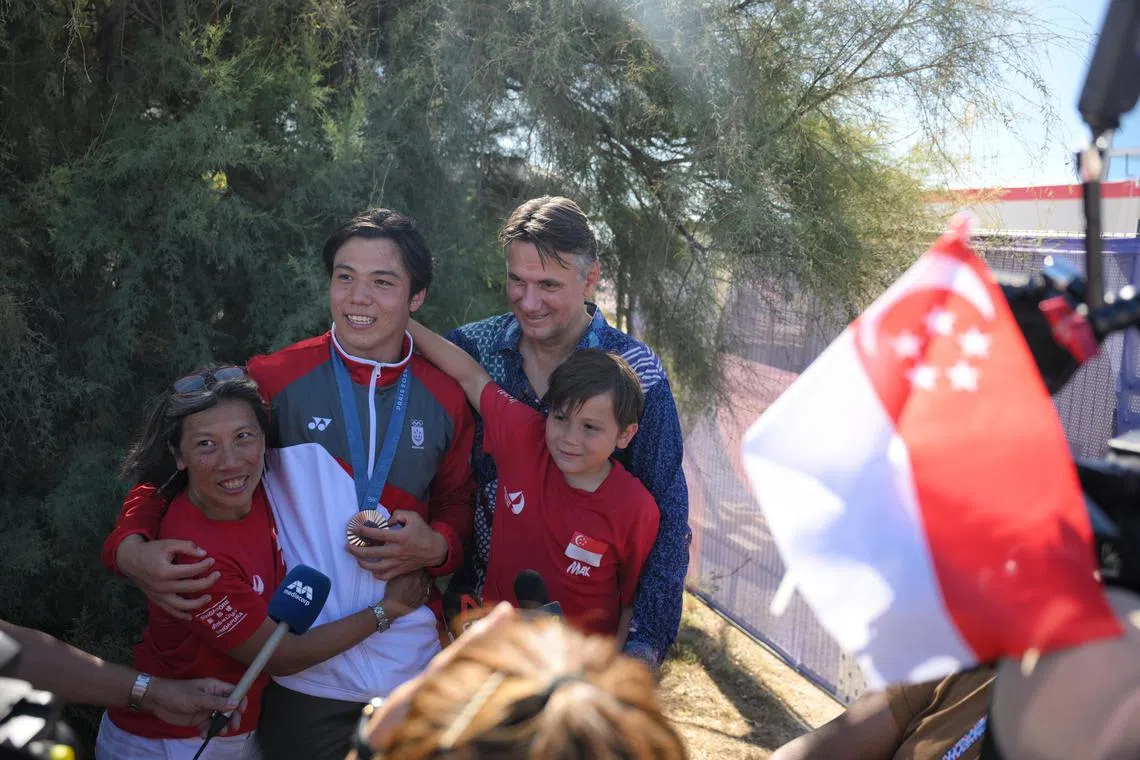 Maximilian Maeder with his parents and brother during an interview with Singapore press after the Paris 2024 Olympics Men’s Kite final at the Marseille Marina on August 9.