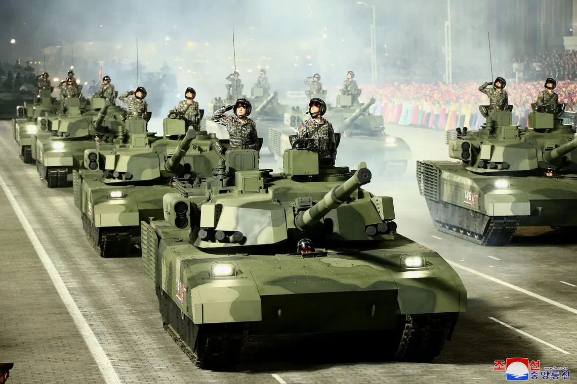 This photo, released by North Korea's official Korean Central News Agency on April 26 shows troops saluting on tanks during a military parade. The United States said on Nov 2, 2022 that North Korea is sending a significant amount of artillery ammunition to Russia, which North Korea has denied.